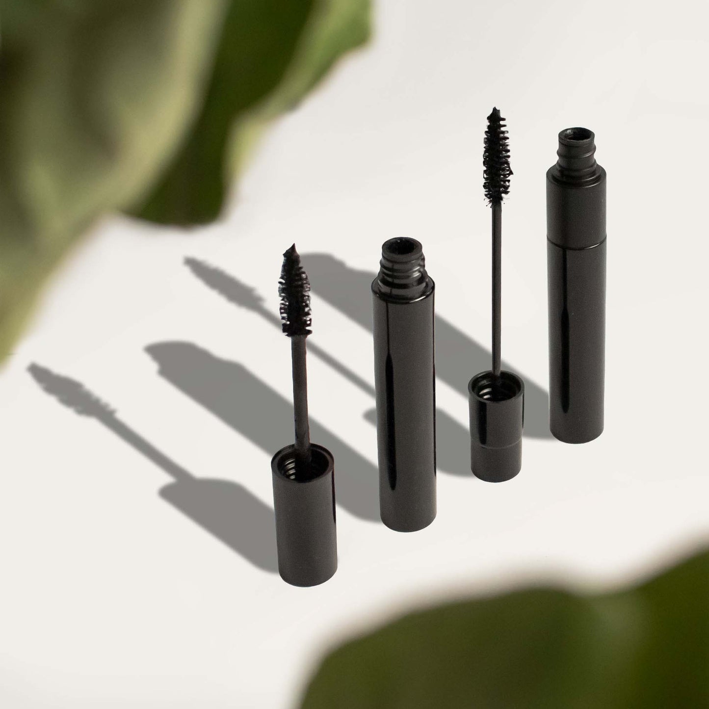 Premium MIANIMED skincare mascara tubes on a neutral background.