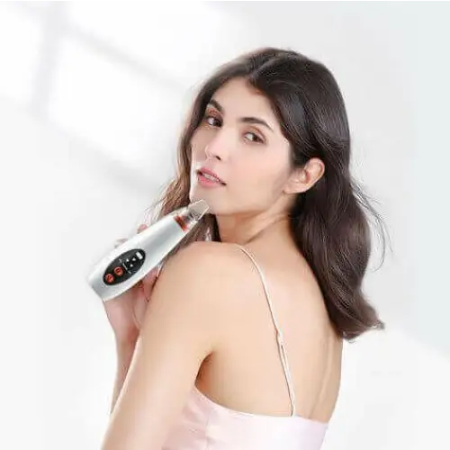 Woman using MIANIMED premium skincare device for facial treatment