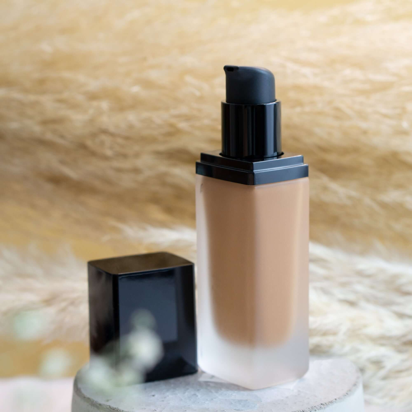 MIANIMED premium skincare product in frosted bottle with pump dispenser on a textured background