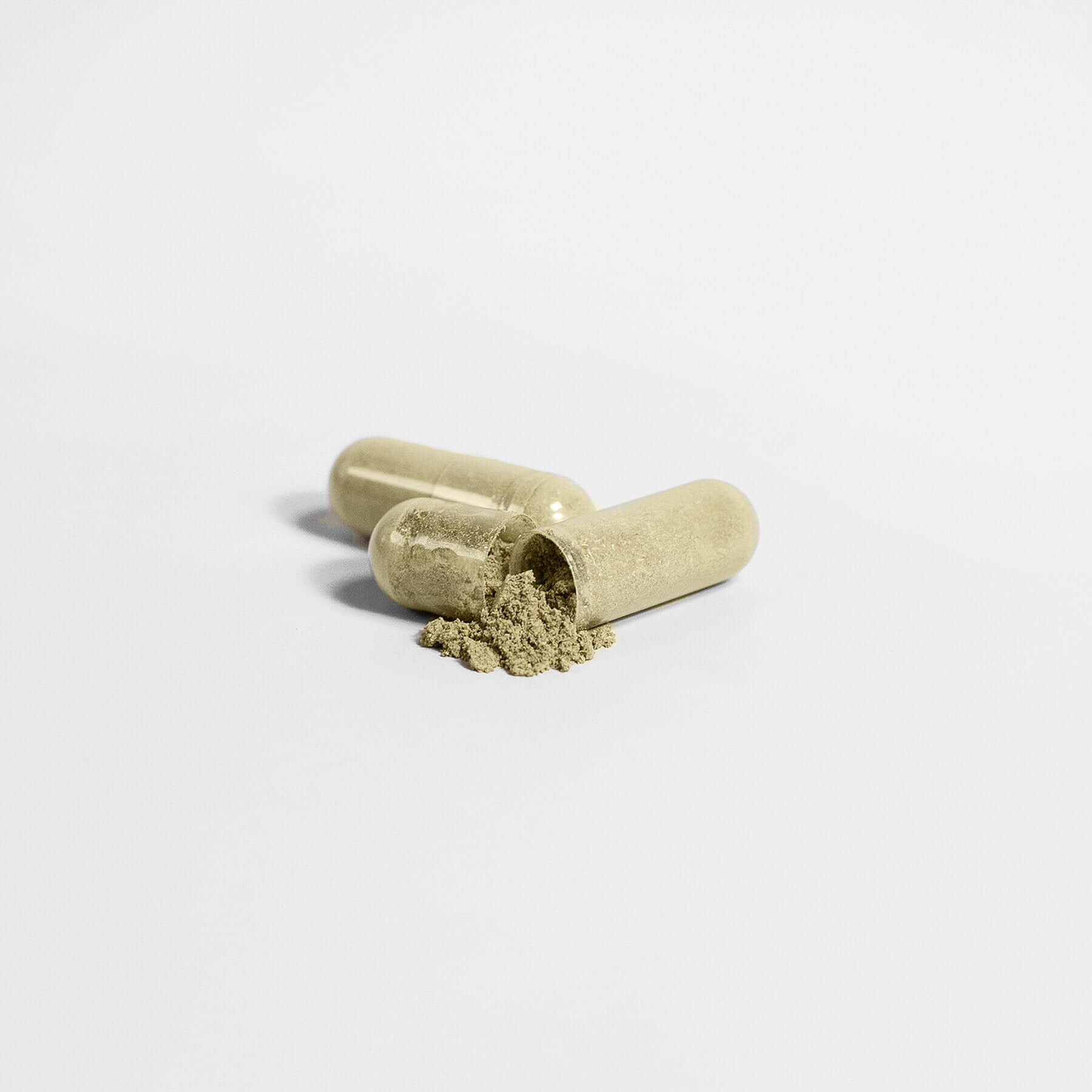 MIANIMED premium skincare capsules with herbal powder on white background.