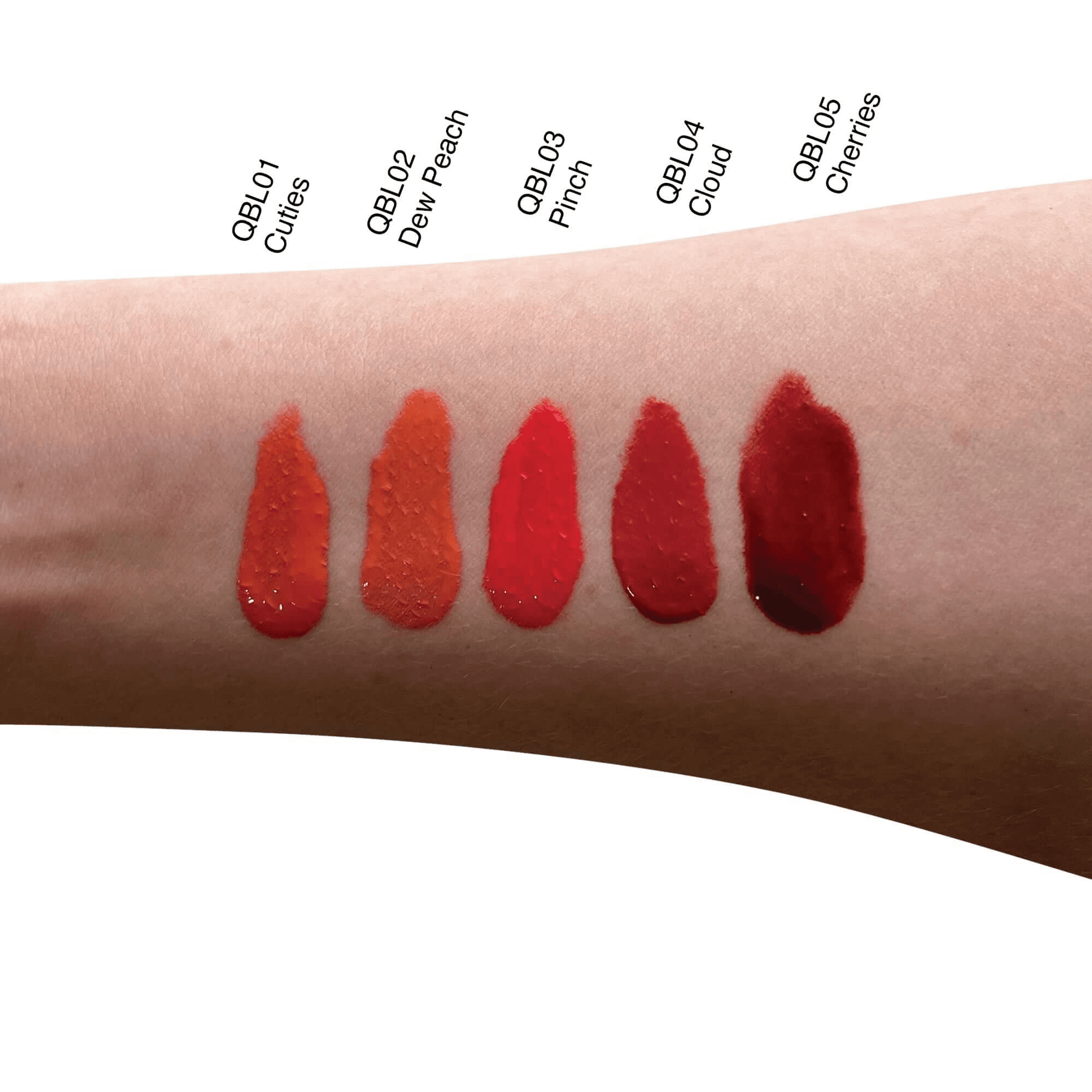 Swatches of MIANIMED Premium skincare lip colors in various shades on a forearm, including QBL01 Cuties, QBL02 Dew Peach, QBL03 Pinch, QBL04 Cloud, QBL05 Cherries.