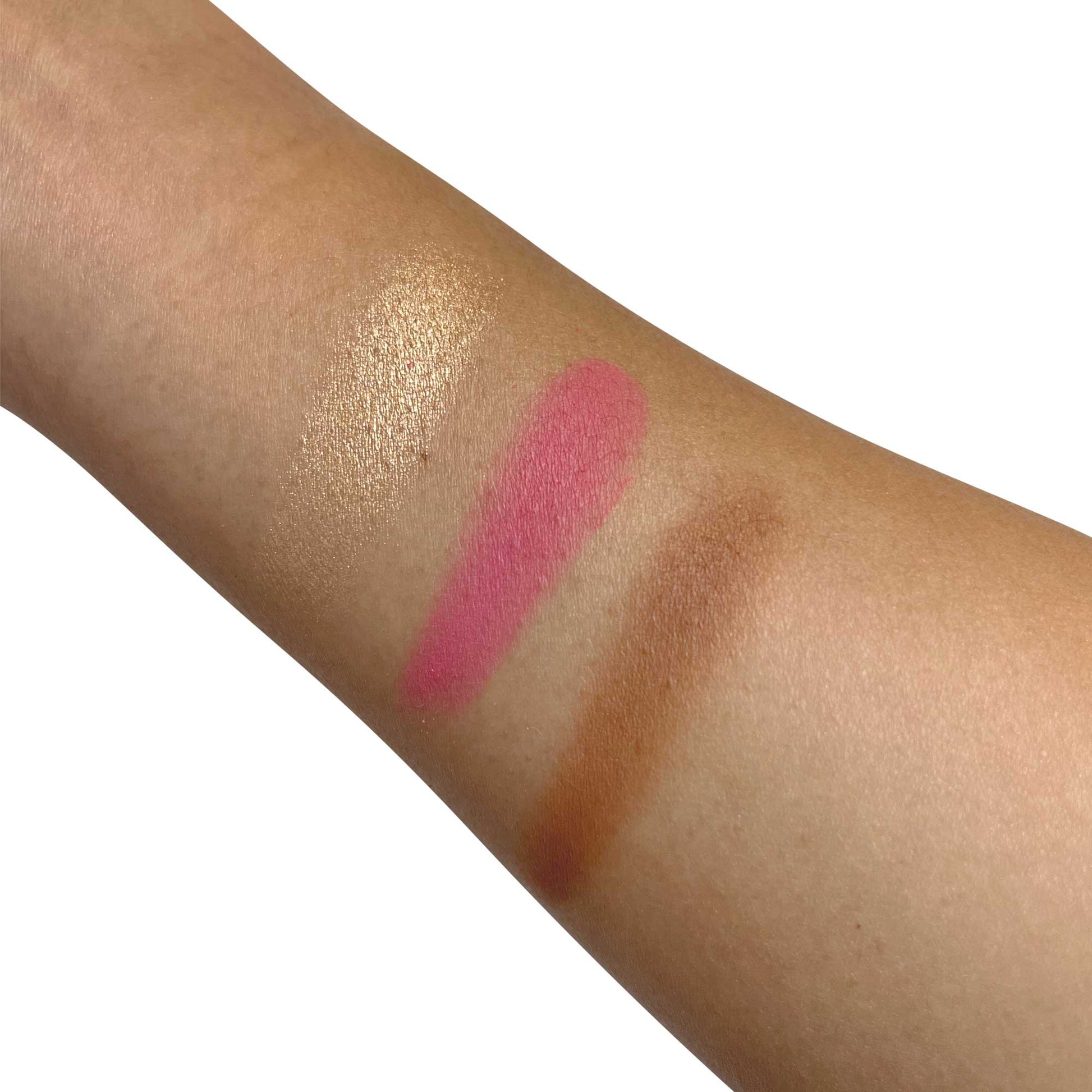 Swatches of MIANIMED premium skincare products in cream, pink, and brown shades on a person's arm.