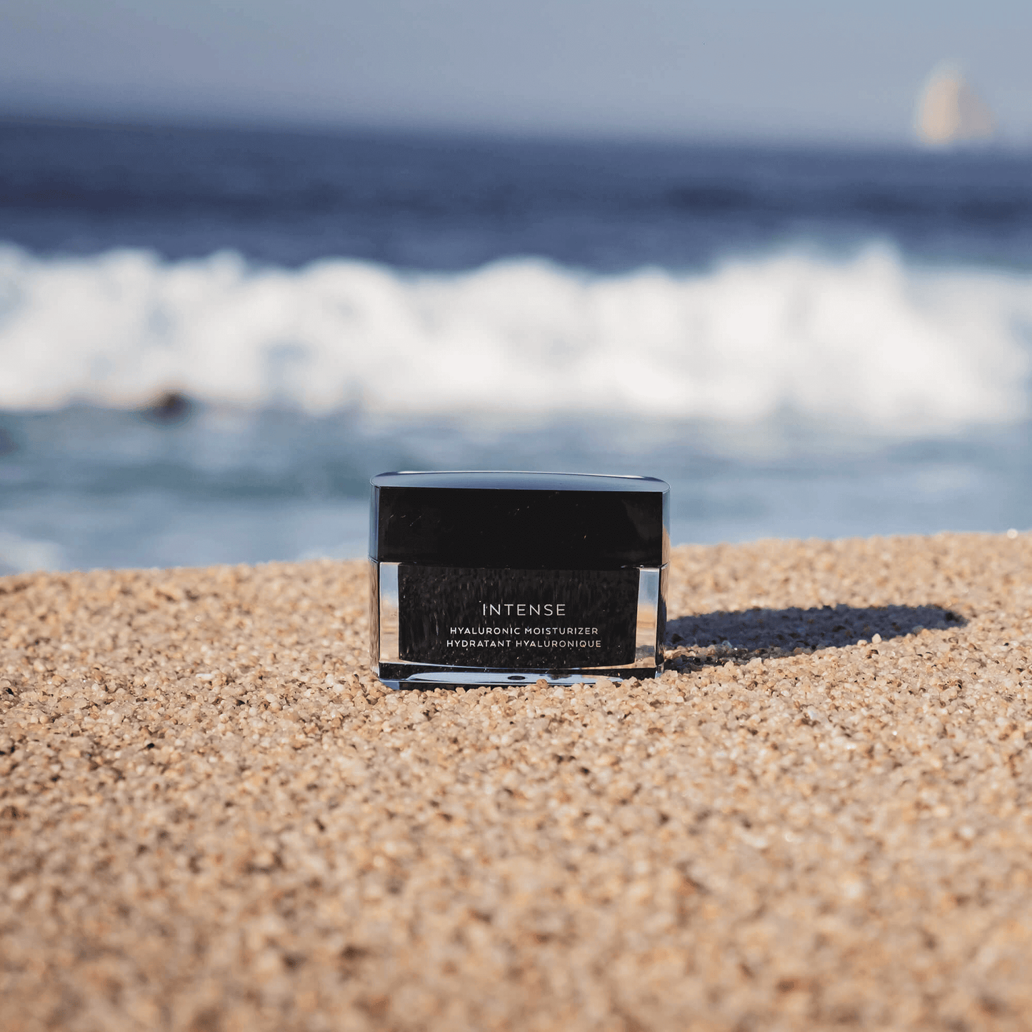 MIANIMED Premium Skincare Intense Hyaluronic Moisturizer on Sandy Beach Near Ocean Waves